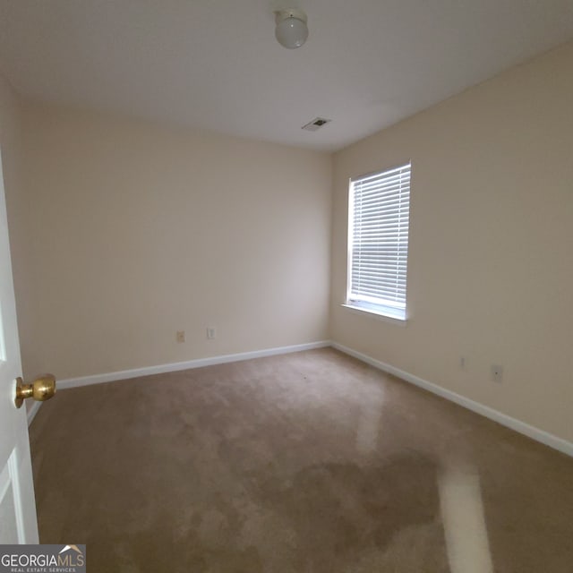 view of carpeted spare room