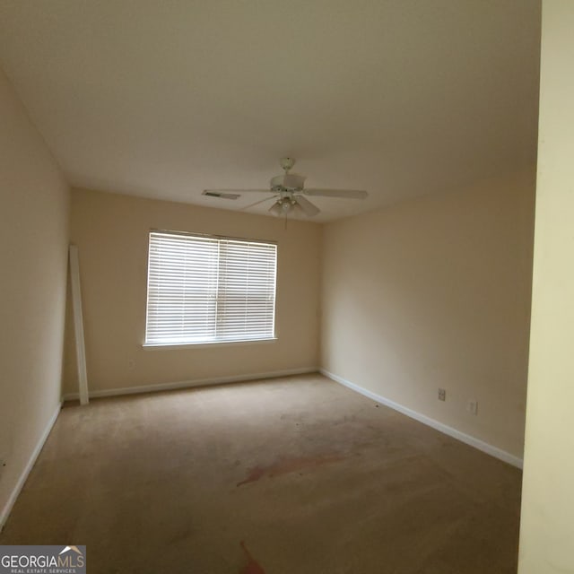 carpeted empty room with ceiling fan