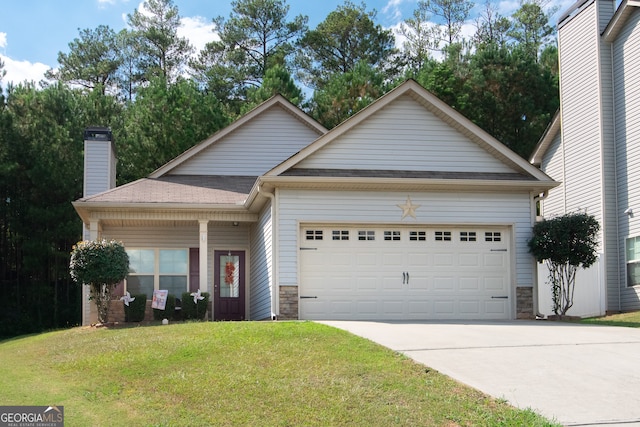 view of front of property with a garage and a front yard