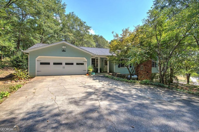 single story home with an attached garage and driveway