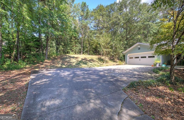 exterior space with concrete driveway