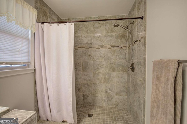 full bathroom with a tile shower