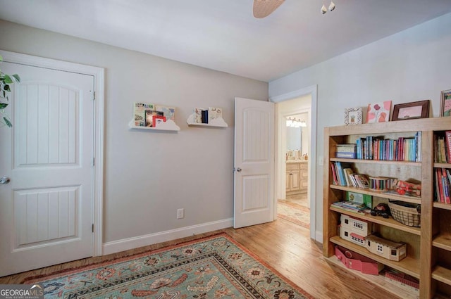 interior space with light wood-type flooring and baseboards