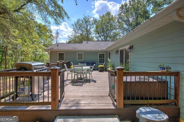 wooden deck featuring outdoor dining area