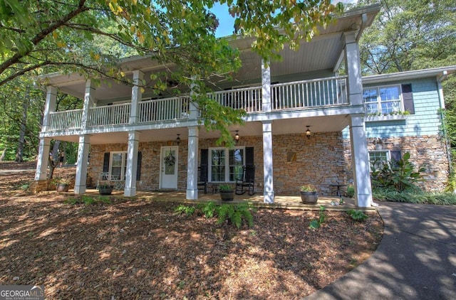 view of front of house featuring a balcony