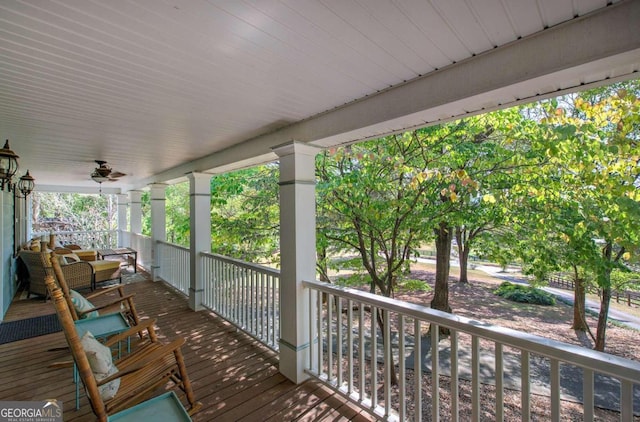 deck featuring ceiling fan and a porch