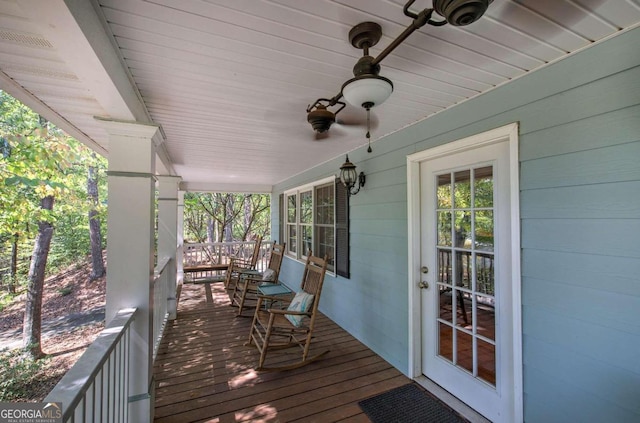 deck with a porch and a ceiling fan