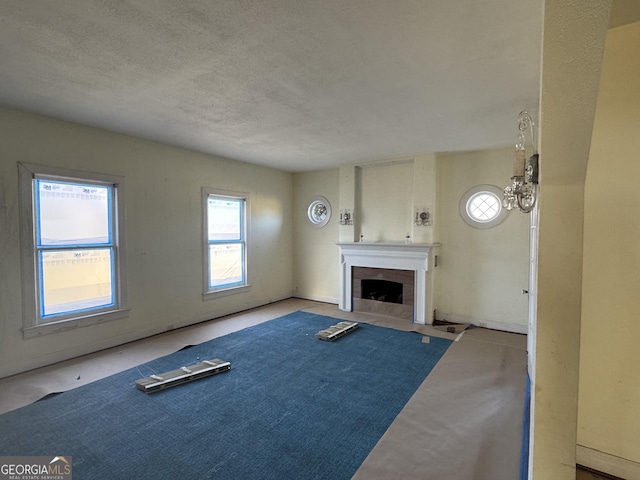 unfurnished living room with a textured ceiling