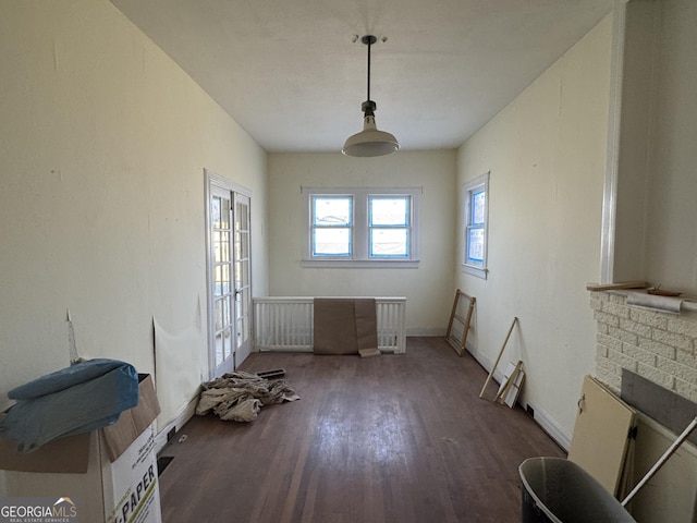 interior space with french doors and dark wood-type flooring