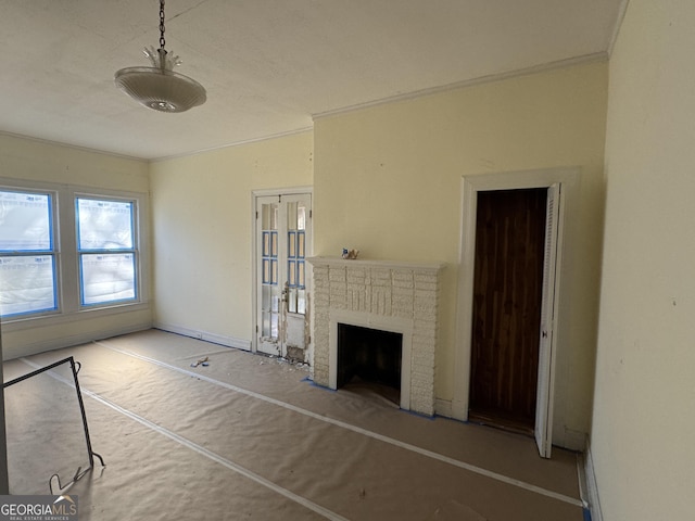 unfurnished living room featuring a brick fireplace and ornamental molding