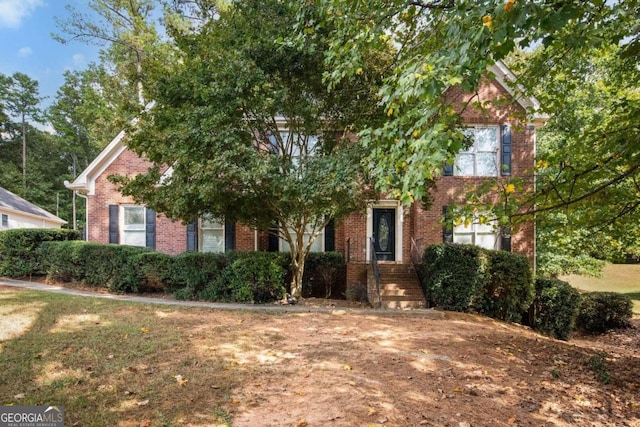 view of property with a front lawn