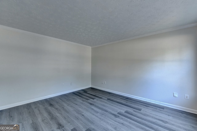 unfurnished room with crown molding, a textured ceiling, and dark hardwood / wood-style flooring