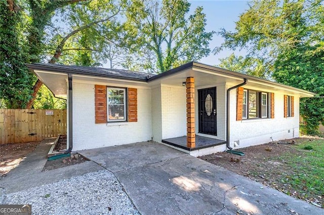 single story home featuring a patio