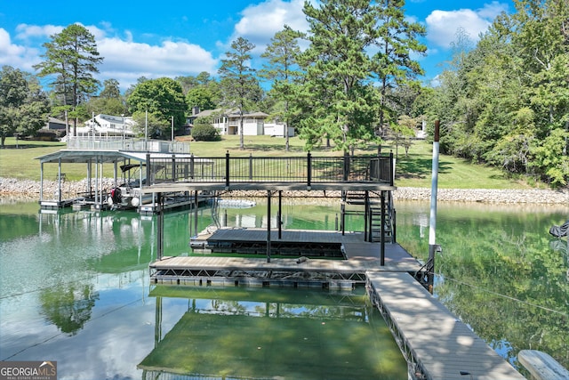 view of dock with a water view and a lawn