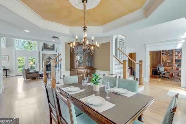 dining room with ornamental molding and a tray ceiling