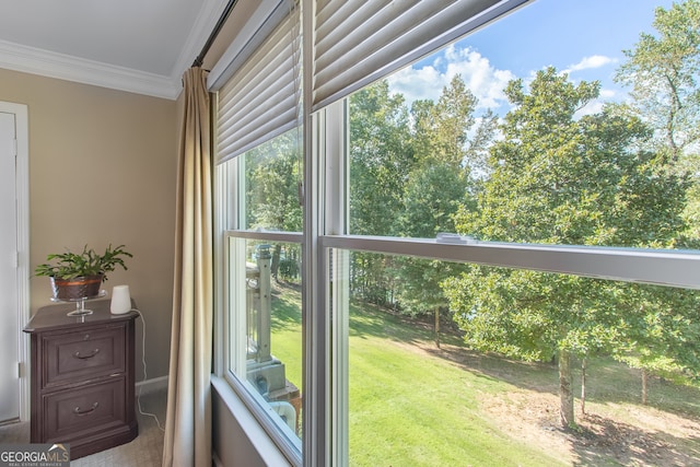 doorway featuring crown molding