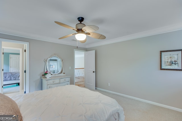 carpeted bedroom featuring ceiling fan and ornamental molding