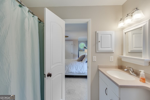 bathroom with vanity and crown molding