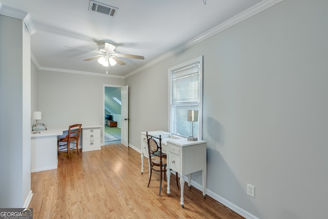 office space featuring ornamental molding, light hardwood / wood-style flooring, built in desk, and ceiling fan