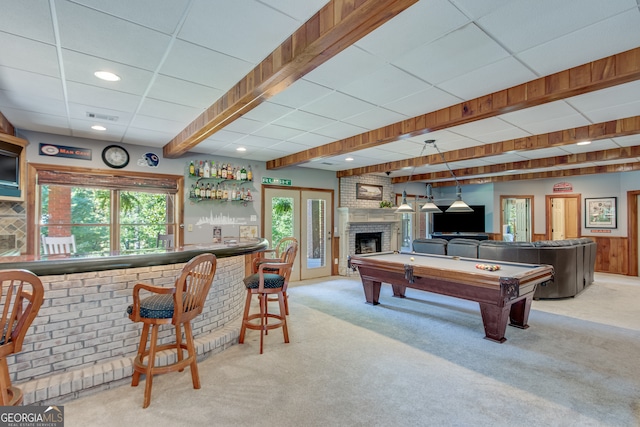 game room with a fireplace, bar area, beamed ceiling, light colored carpet, and billiards