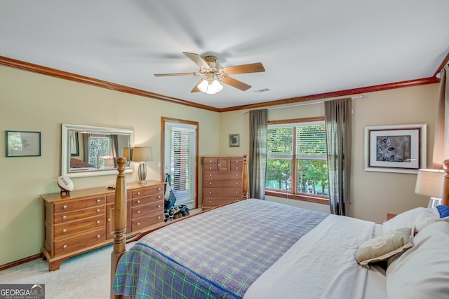 bedroom featuring ornamental molding, light colored carpet, and ceiling fan