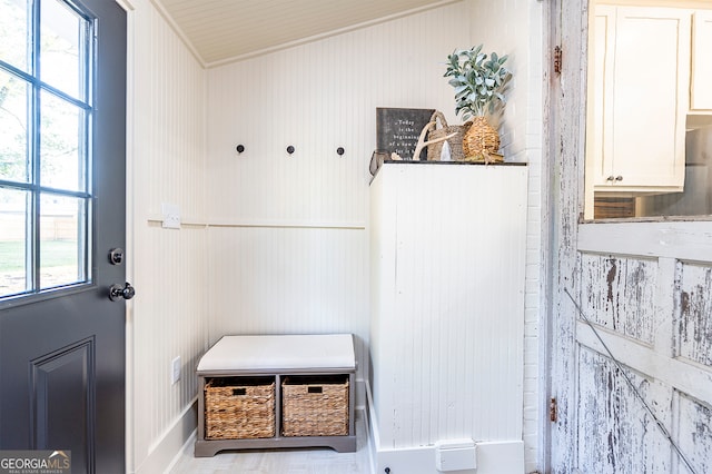 mudroom with wooden walls