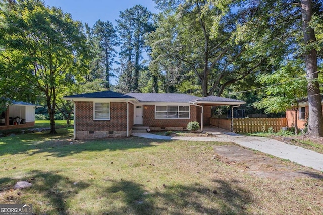 ranch-style home with a front yard and a carport