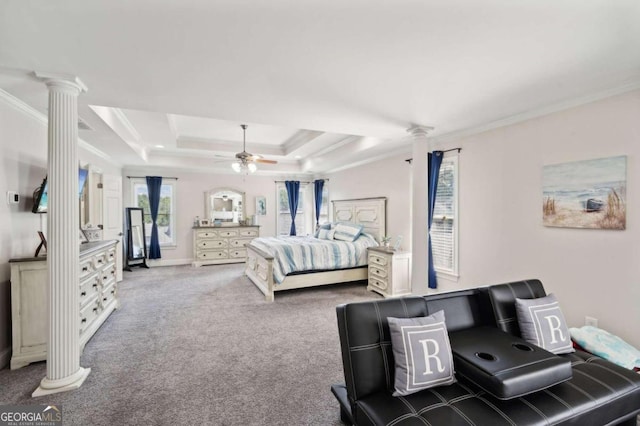 carpeted bedroom with a tray ceiling, decorative columns, ceiling fan, and crown molding