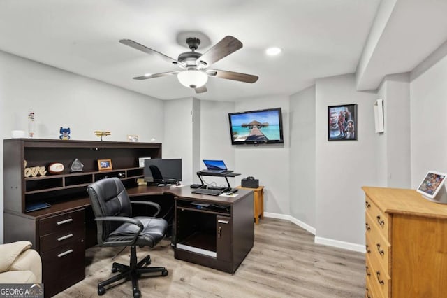 office space with light wood-type flooring and ceiling fan