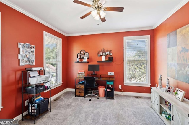 office featuring a wealth of natural light, ceiling fan, and light colored carpet