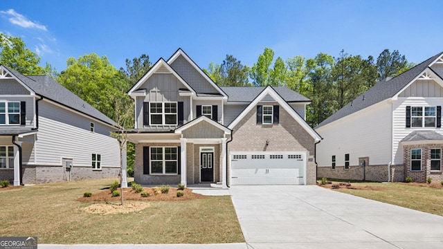 craftsman-style home featuring a front yard, board and batten siding, brick siding, and concrete driveway