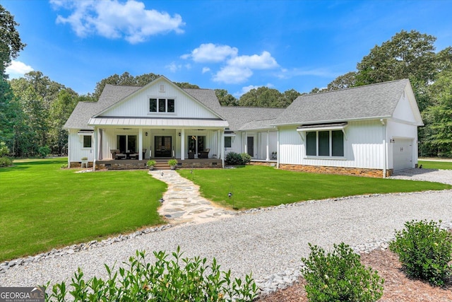 1370 Deerwood Cir, Stapleton, GA 30823 - modern inspired farmhouse featuring an attached garage, a porch, roof with shingles, and a front yard