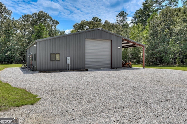 1370 Deerwood Cir, Stapleton, GA 30823 - garage featuring a detached garage and driveway
