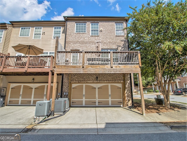 exterior space featuring cooling unit and a garage