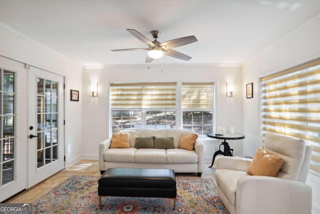 living room featuring light hardwood / wood-style floors, ornamental molding, ceiling fan, and a wealth of natural light