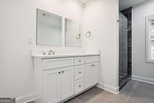 bathroom featuring vanity, ornamental molding, an enclosed shower, and tile patterned floors