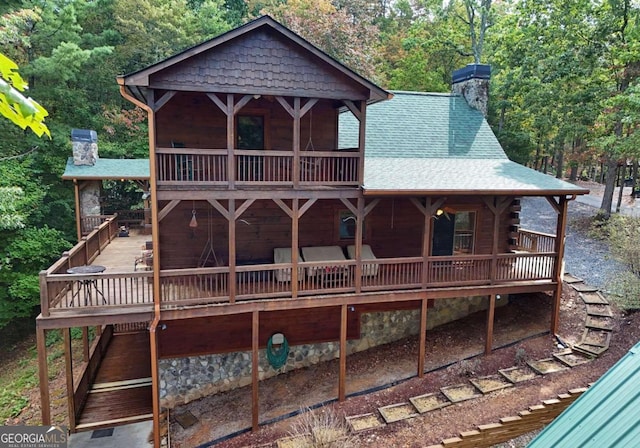 rear view of house with a deck