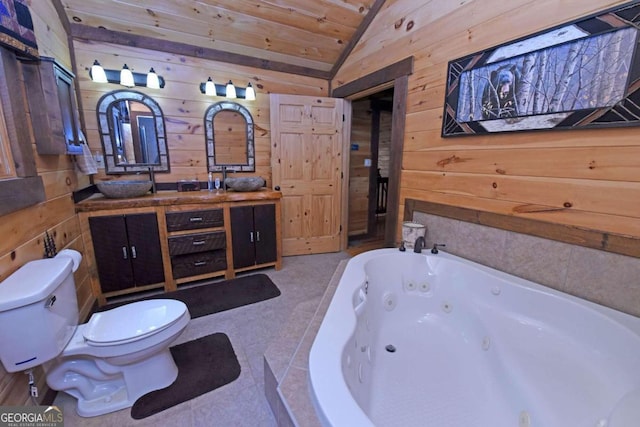 bathroom featuring vanity, lofted ceiling, a washtub, tile patterned floors, and toilet