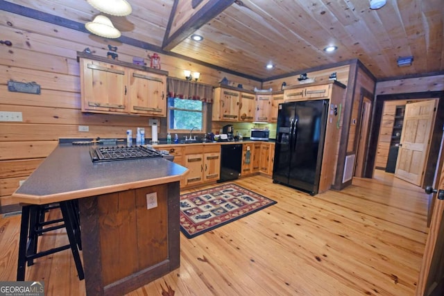 kitchen with wood ceiling, light hardwood / wood-style floors, a kitchen breakfast bar, and black appliances