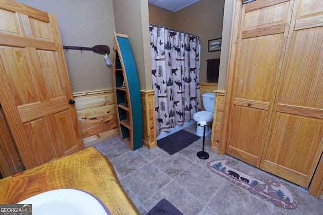 bathroom with tile patterned flooring and toilet