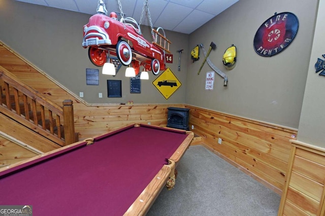 playroom with wooden walls, pool table, and carpet