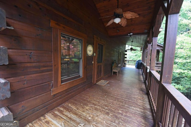 wooden deck with ceiling fan and a grill