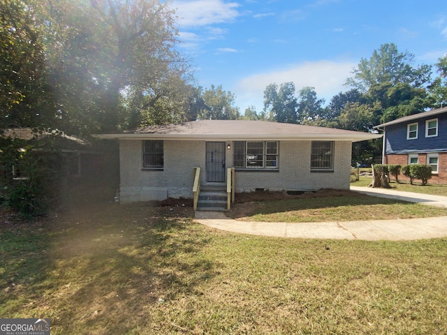 view of front of property with a front lawn