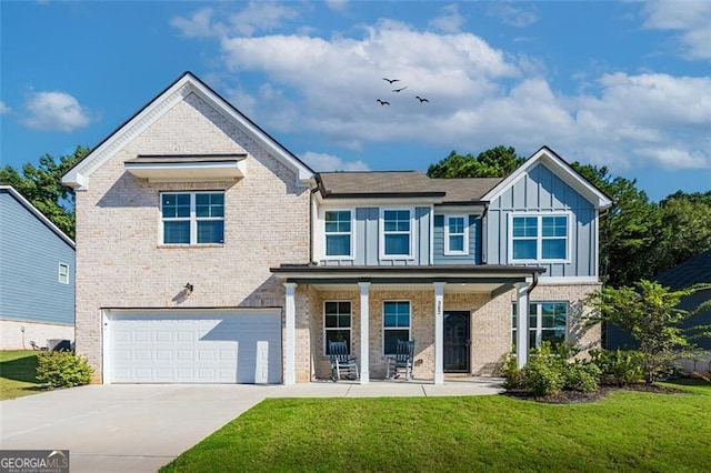 view of front of property with a front lawn and a garage