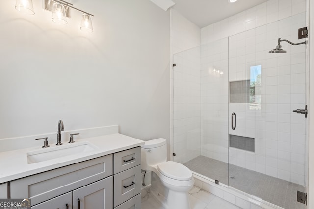 bathroom with walk in shower, vanity, and toilet