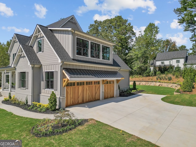 view of front of house featuring a front yard and a garage