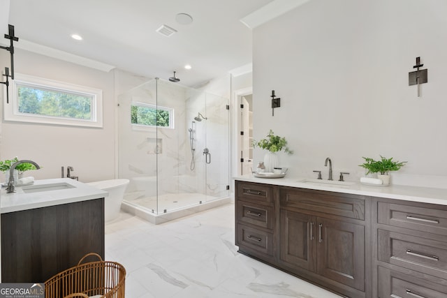 bathroom with a shower with door and vanity