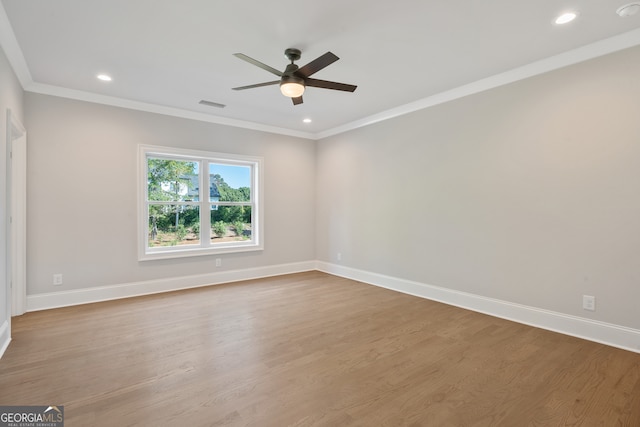 spare room with ornamental molding, ceiling fan, and hardwood / wood-style floors