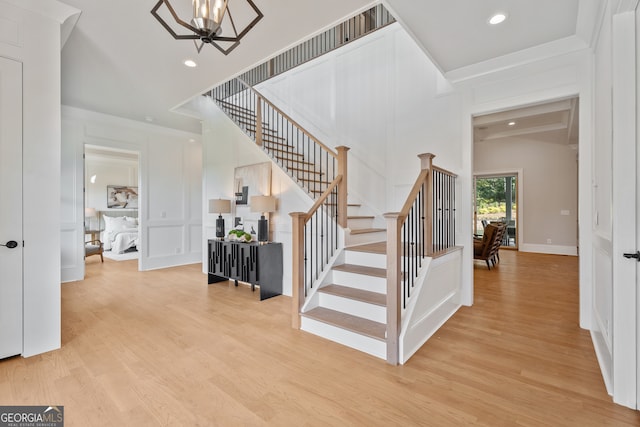 interior space with an inviting chandelier and hardwood / wood-style floors