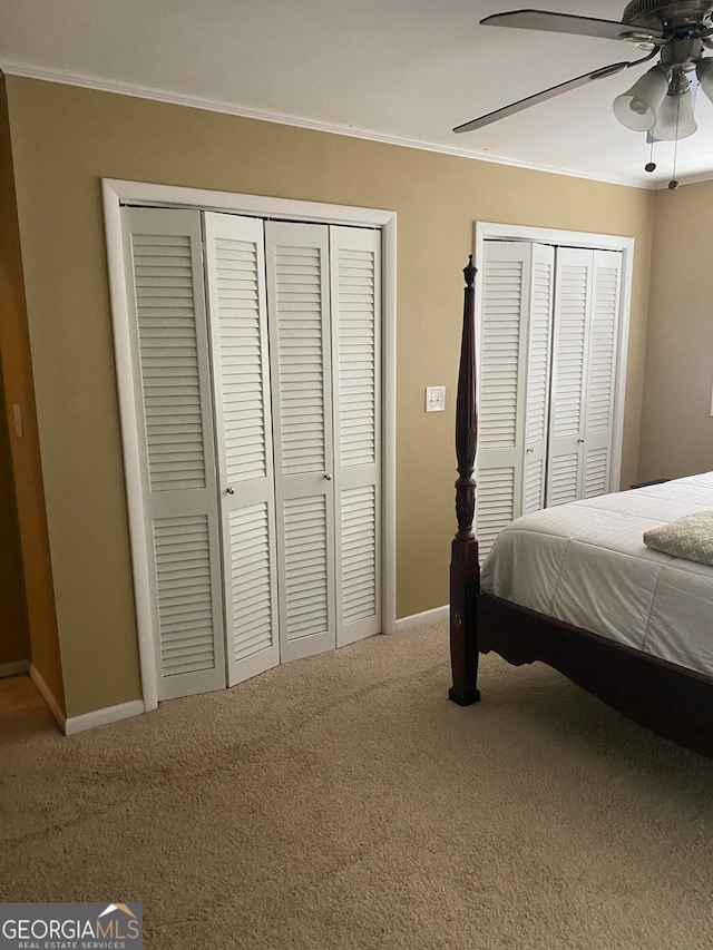 bedroom featuring carpet flooring, ceiling fan, and ornamental molding